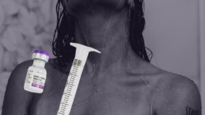 "Syringe and contraceptive injection vial on a woman’s shoulder. Emphasizes meningioma from Depo-Provera and information on Depo-Provera brain tumor risks